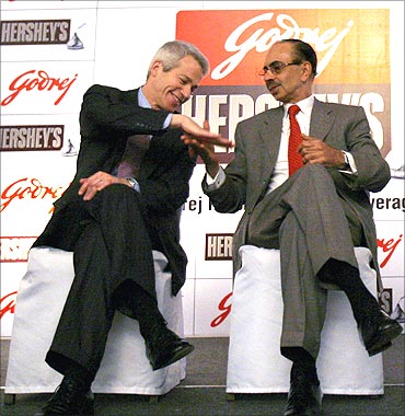 Richard H. Lenny (L), Chairman and Chief Executive Officer of Hershey Co., and Adi Godrej (R).