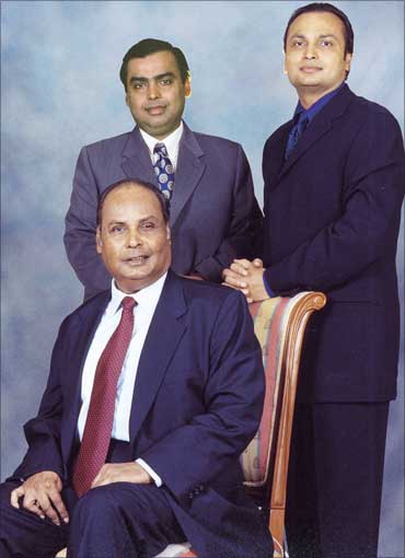Mukesh Ambani (L-standing), Anil Ambani (R-standing) and Dhirubhai Ambani (seated).