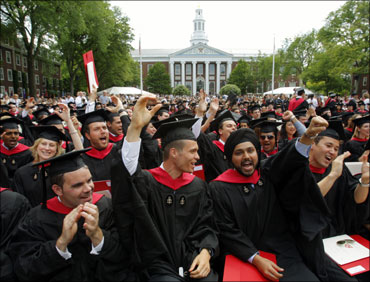 Harvard Business School students cheer during their graduation ceremonies in Boston, Massachusetts.