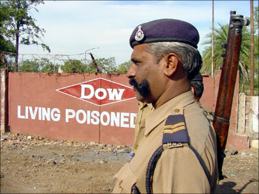 A policeman stands outside the Union Carbide factory in Bhopal.