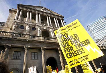 Anti-capitalist student protestors demonstrate outside the Bank of England in London.