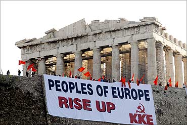 A giant banner protesting Greece's austerity measures.