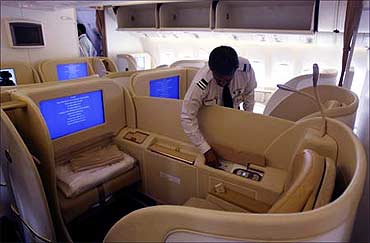 An official looks at the first class cabin section in Air India's new Boeing 777-20.