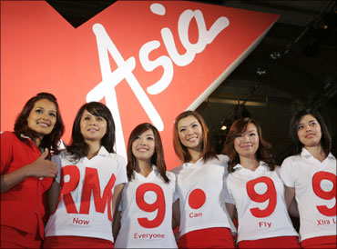 Malaysian budget carrier AirAsia stewardesses.