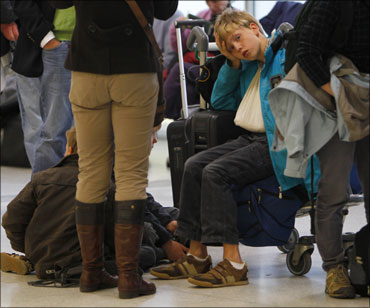Harried tourists stranded at an airport in UK.