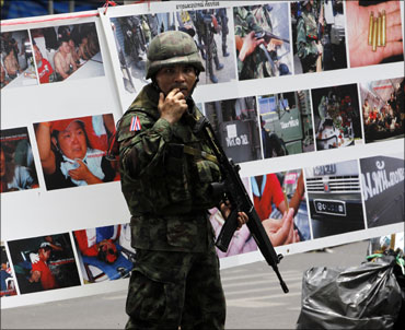 A Thai soldier patrols the streets of Bangkok.