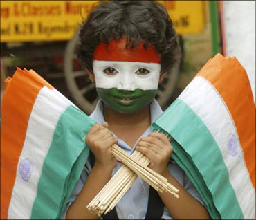 A child selling Indian flags.