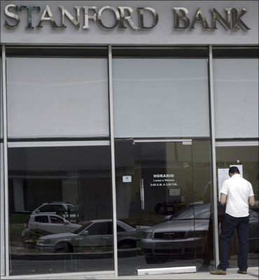 A man reads a notice outside a Stanford Bank branch in Panama City.