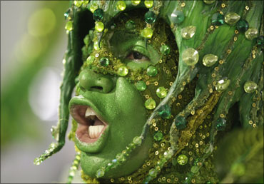 A reveller dances during the Carnival parade in Rio de Janeiro, Brazil.