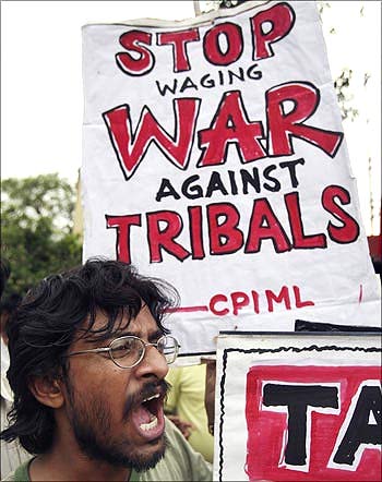An activist of Communist Party of India (Marxist-Leninist) shouts anti-government slogans.