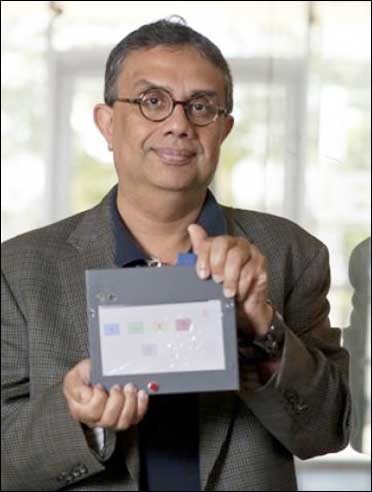 Rice University computer scientist Krishna Palem with an I-slate prototype.