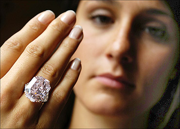 A rare intense purple-pink cut-cornered rectangular mixed-cut diamond ring