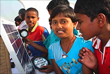 Children with solar lights.