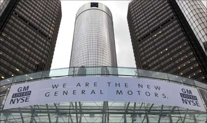 A banner hangs at the front of the General Motors Co world headquarters.