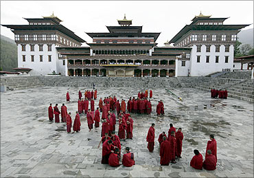 Buddhist monks stand inside the complex of Tashichhodzong in Bhutan's capital Thimphu.