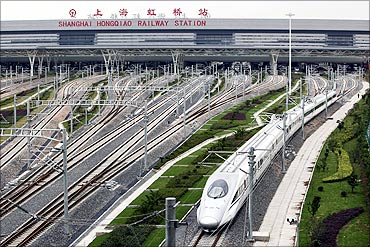 A high-speed train travels on the newly built Shanghai-Hangzhou railway in Shanghai.