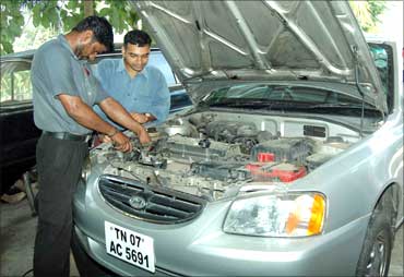 Rangarajan with a mechanic at Ignite.