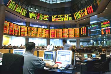A broker at work in the Malaysia Stock Exchange.