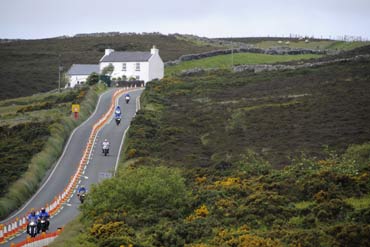 Motorcyclists ride their bikes on the roads at Creg-ny-Baa during 'Mad Sunday' at the TT meeting, on the Isle of Man.