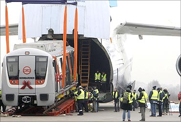 A rail carriage is loaded into an Antonov 124 cargo aircraft.