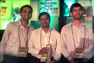 Abhinav Sinha, Anupam Varghese and Harish Lodwal with the Best IT Implementation Award 2010.