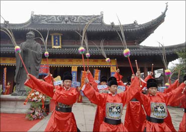 Performers in traditional costumes at a Confucian temple in Nanjing.