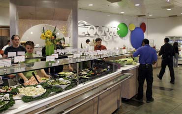 Employees choose their free lunch from one of fifteen different cafes at Google headquarters in Mountain View, California.