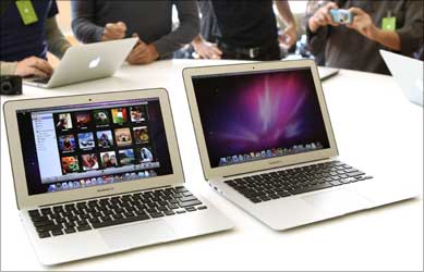 Media and guests check out Apple's latest MacBook Air models and new operating system.