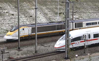 An Eurostar passes a Deutsche Bahn ICE 3 high speed train leaving the Channel Tunnel.
