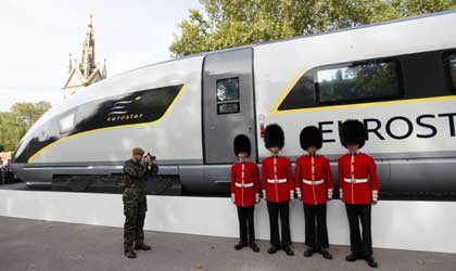 Four members of the Scot's Guards pose next to a new Eurostar train.