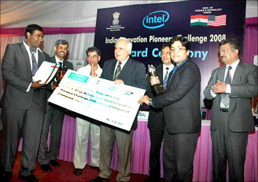 HRD Minister Kapil Sibal presents India Innovation Pioneers' Challenge award to Kranthi.