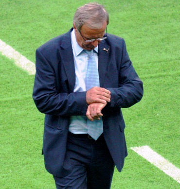 Austria's coach Hickersberger looks at his wristwatch during their Group B Euro 2008 soccer match.