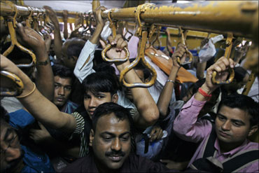 Commuters packed like sardines in a Mumbai local train.