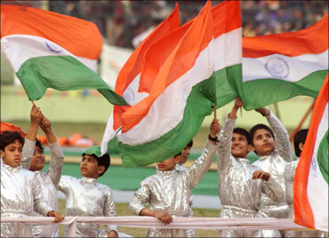 Indian children waving the Tricolour.