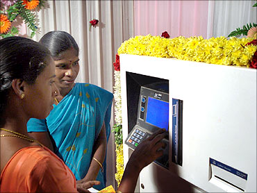 Villagers use an ATM.