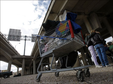 A shopping cart with a homeless person's belongings is seen under an overpass in Waco, Texas.