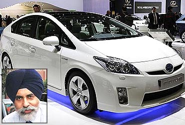 A Toyota Prius 3 is displayed at the 79th Geneva Car Show at the Palexpo. (Inset) Sandeep Singh.