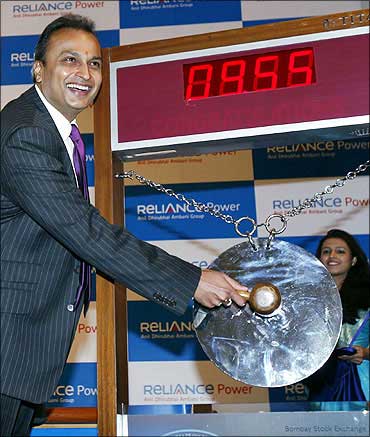 File photo of Anil Ambani striking a gong during the listing of Reliance Power at the Bombay Stock E