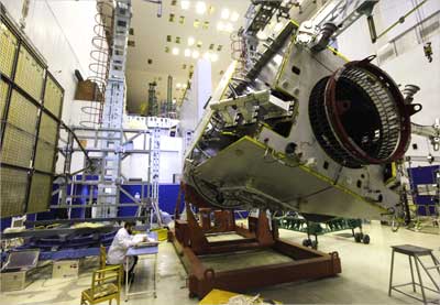 A specialist works on the Indonesian TELKOM-3 space telecommunication satellite.