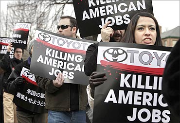 United Auto Workers (UAW) activists protest against Toyota outside the Japanese Embassy.