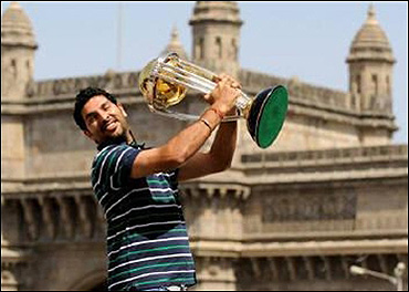Yuvraj Singh holds the World Cup trophy.