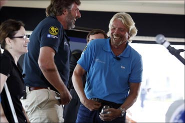 Richard Branson (R) enjoys a moment with Chris Welch.