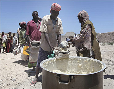 Internally displaced Somali people receive relief food in Madina district, southern Mogadishu.
