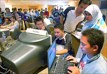 Malaysians participate in a computer attack and defence hacking competition.
