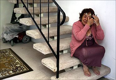 Aida Lemus, 70, cries as she is evicted from her foreclosed condominium in Anaheim, California.