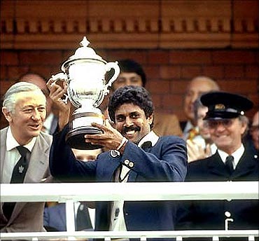 Kapil Dev holds the 1983 World Cup trophy.