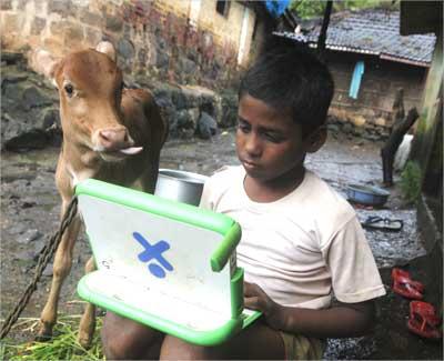 Harish, 11, a school boy uses a laptop provided under the One Laptop Per Child project.