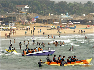 Tourists enjoy on Baga beach in Goa.