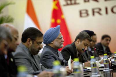 Prime Minister Manmohan Singh (C) holds a bilateral meeting with China's President Hu Jintao (unseen) in Sanya.