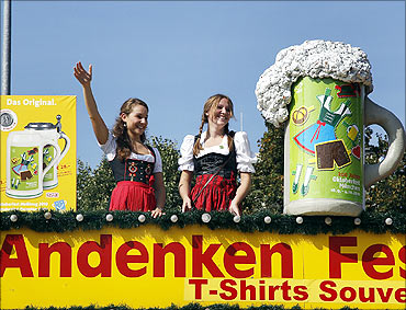 People in traditional Bavarian clothes take part in the 177th Oktoberfest in Munich.